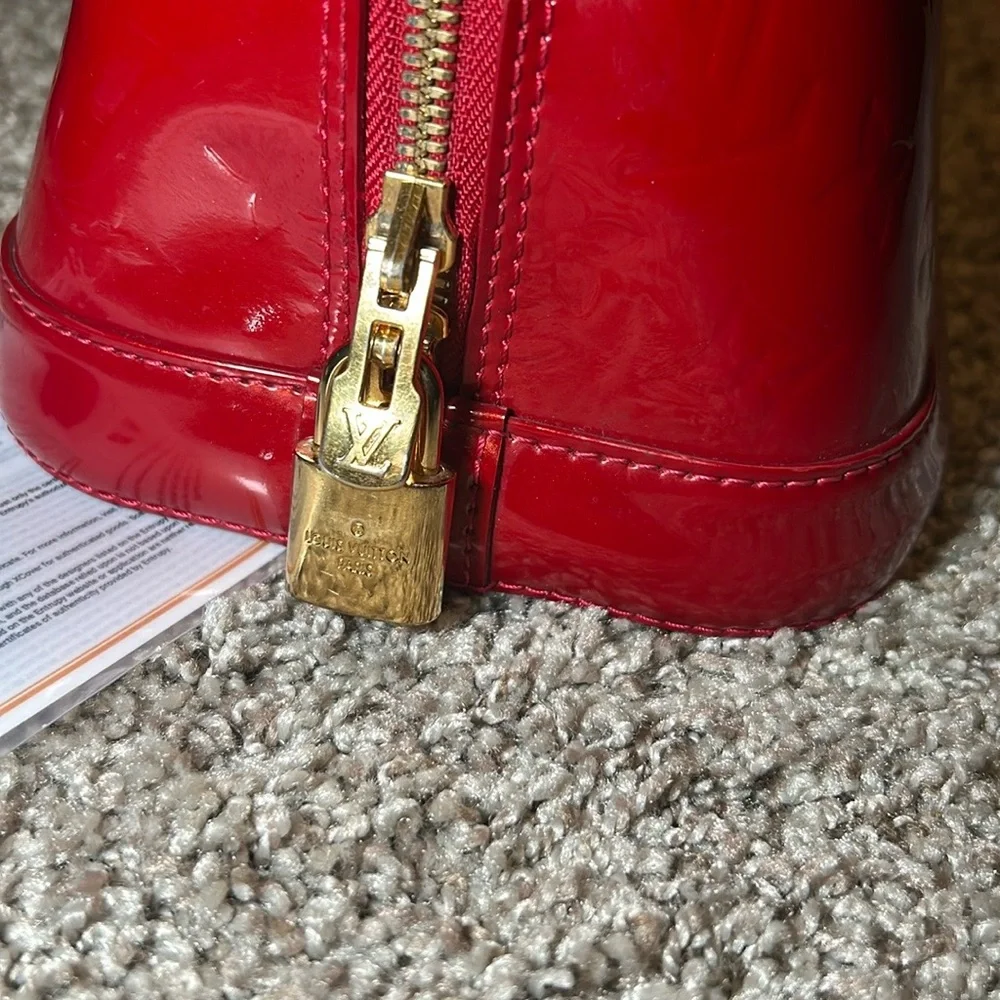 359. Louis Vuitton Red Monogramed Vernis leather Alma